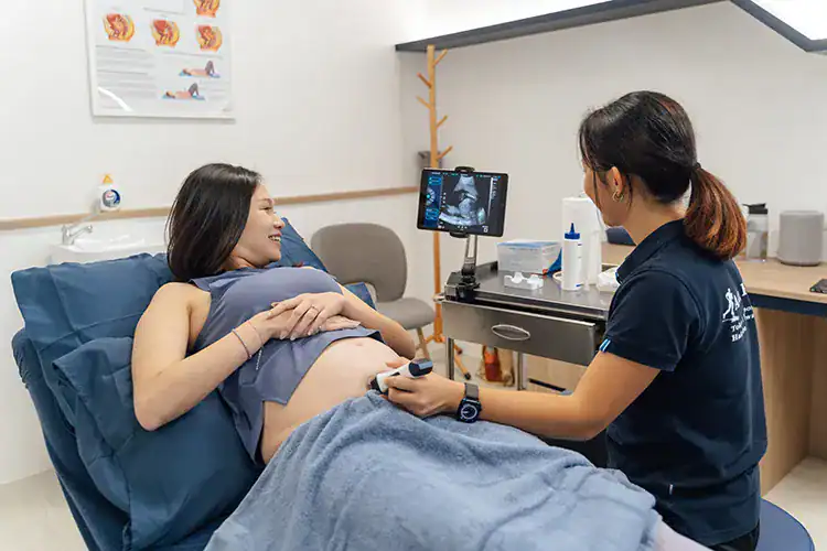 Pregnant woman at Singapore Physio Spine.